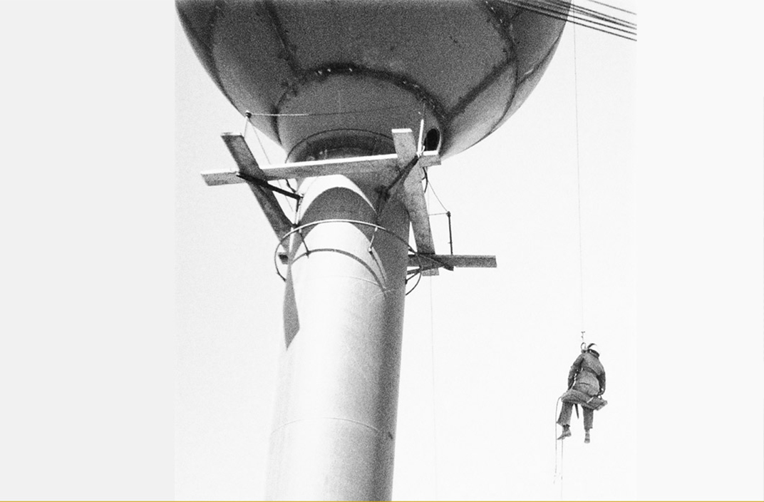 Black and white image of the Airdrie water tower being constructed